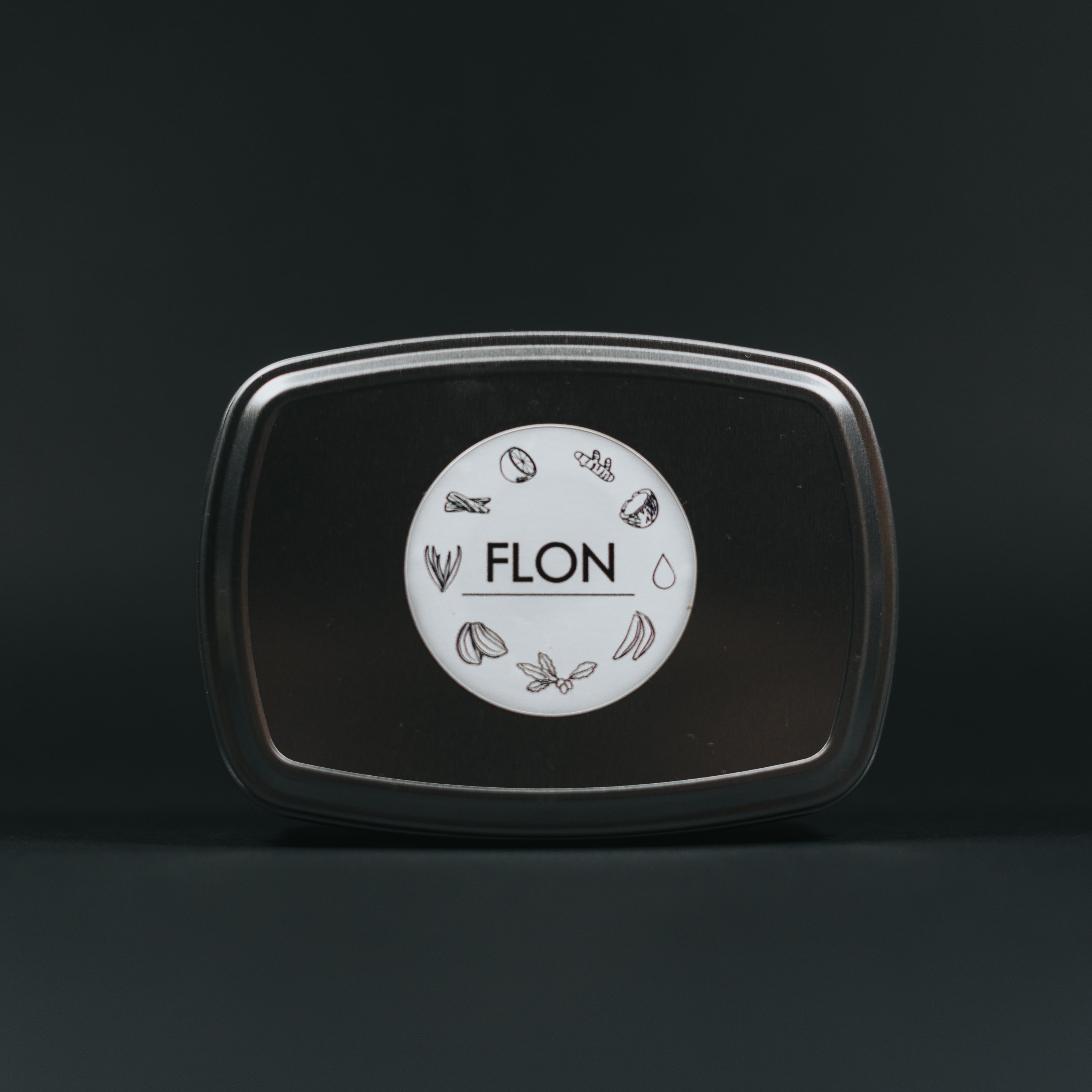 FLON African Black Soap -Ose Abuwe, a natural handmade soap with a rich dark color, showcasing its organic ingredients like shea butter and plantain skins.